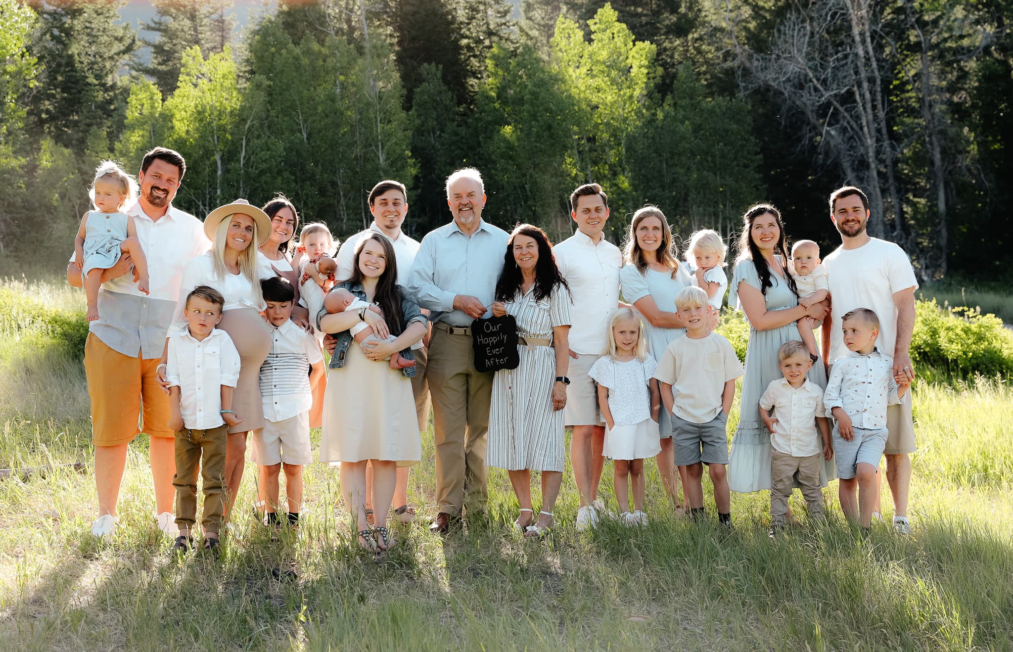 A large, happy family gathered outdoors
